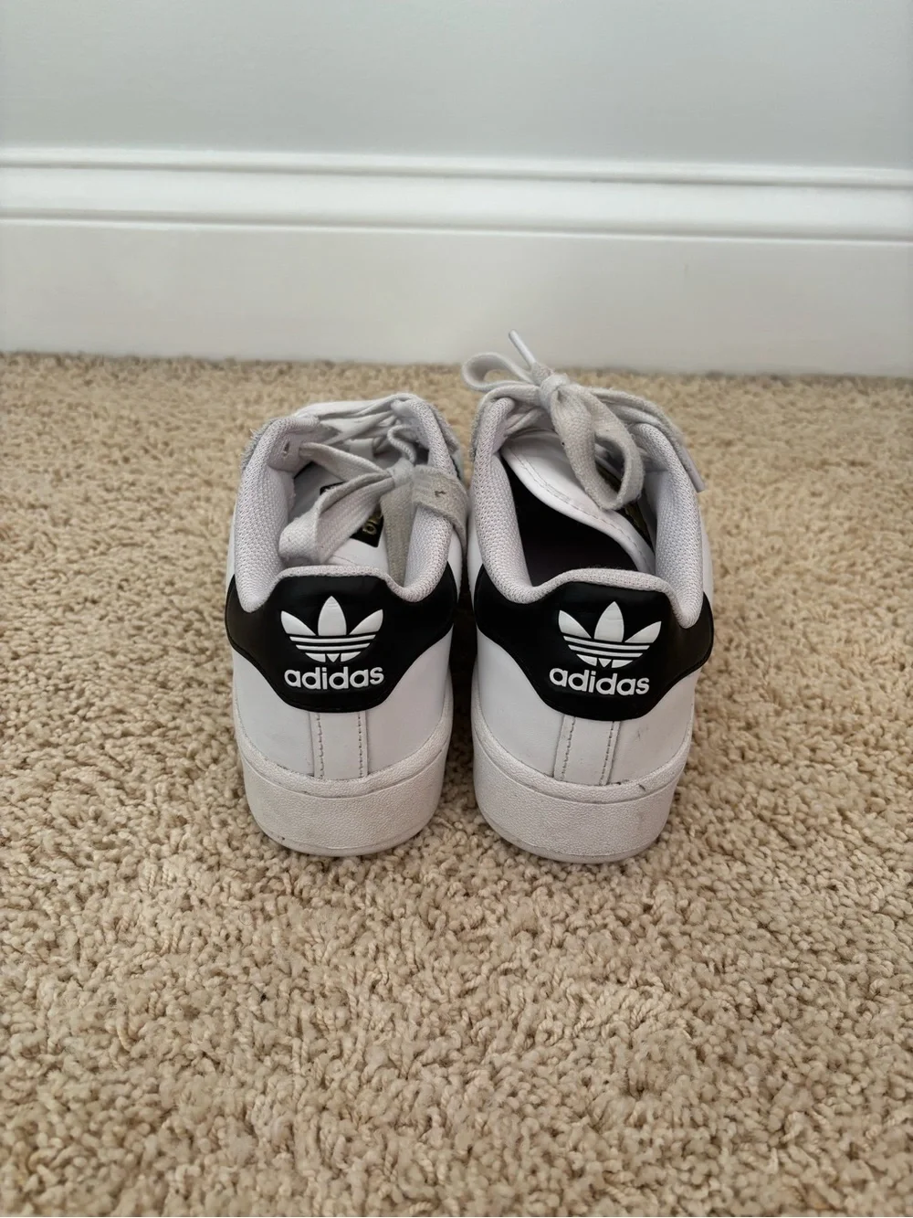 White Adidas Superstars